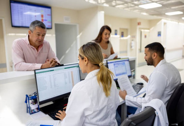 A care coordinator at Health Wellness Grid welcoming a patient